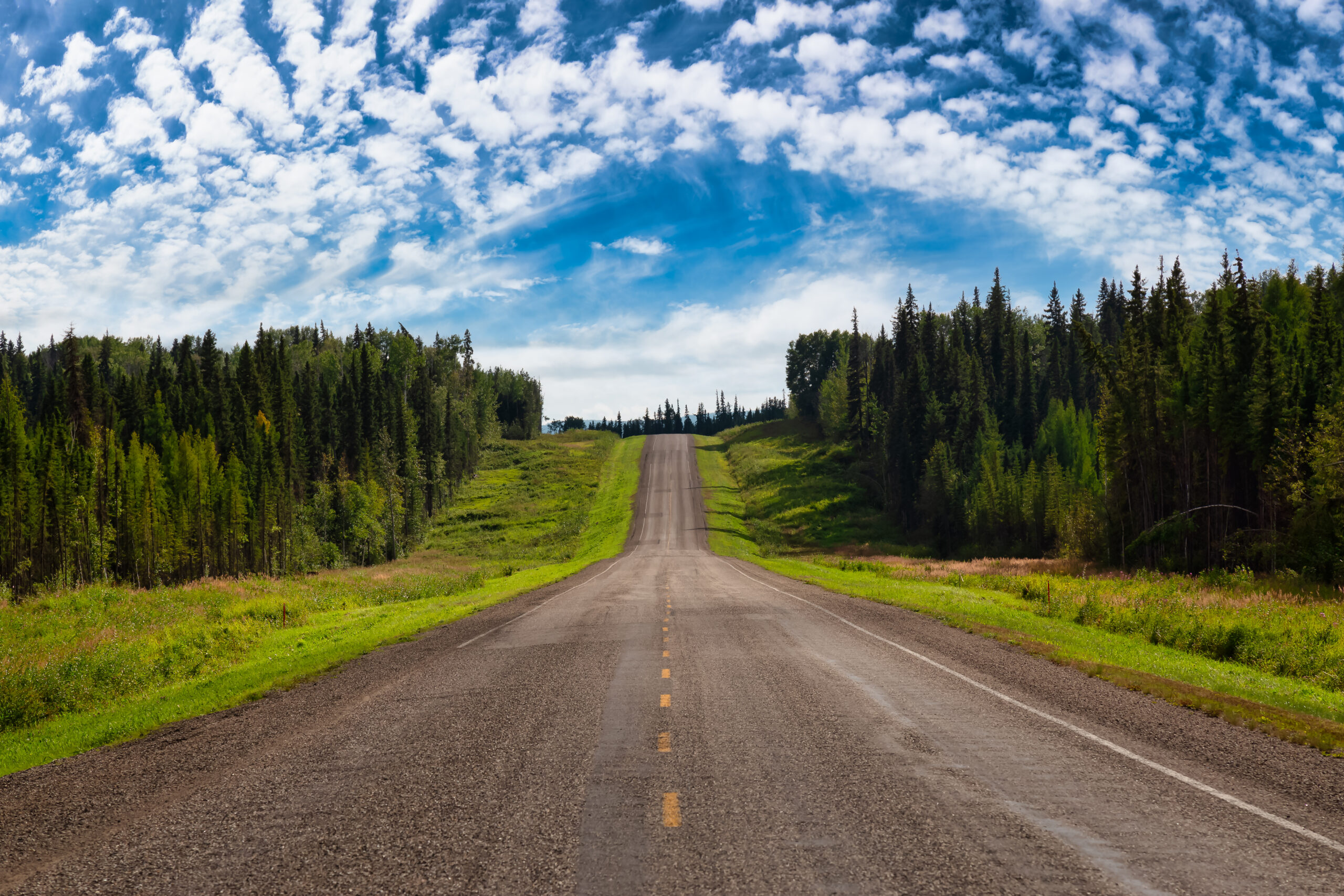 View of a scenic road, Alaska Hwy, in the Northern Rockies