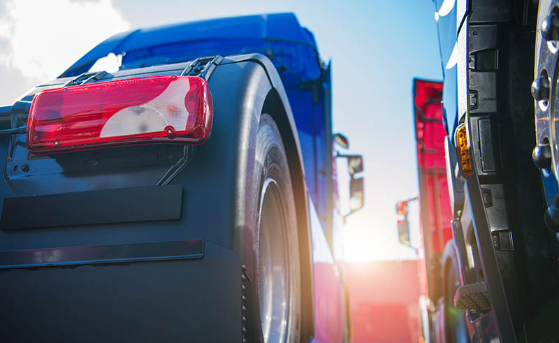 Semi Tractor Trucks Staying Next to Each Other on a Parking